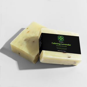 Lavender Bliss Soap Bar with dried lavender flowers. (Image 2 of 4)